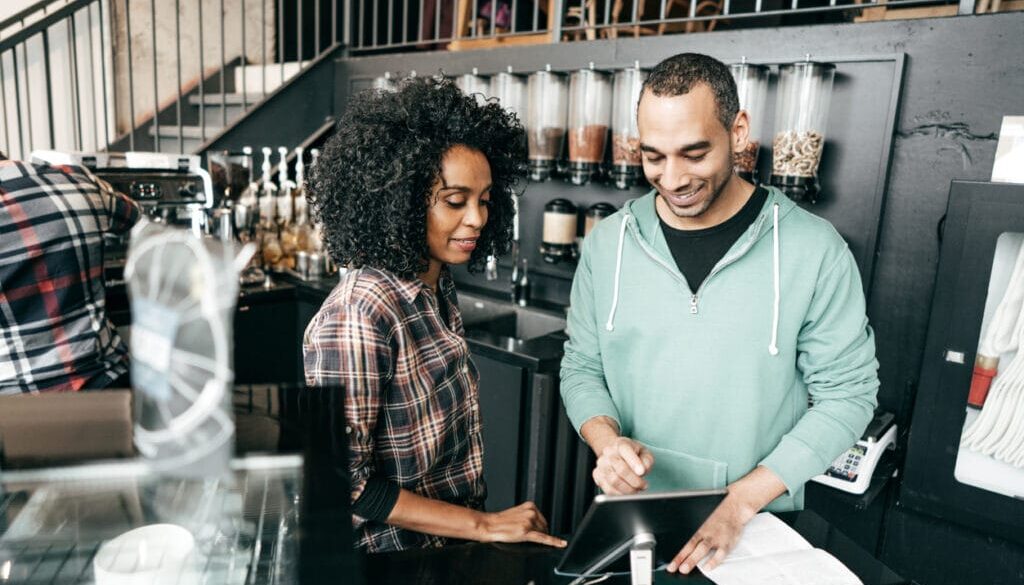smiling cafe owners