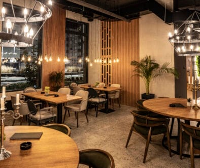 nterior of an empty restaurant at night, with modern design, nice ambient lights and decor, seating area