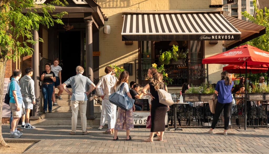 Toronto, Canada - August 29, 2023: People walk and shop along the streets of the fashionable and upscale Yorkville area of downtown Toronto